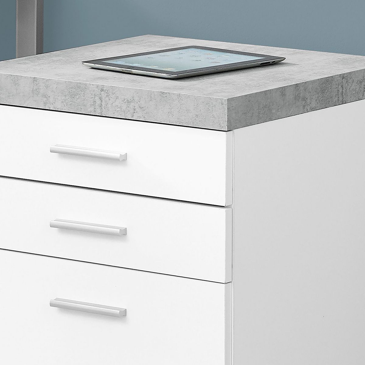 Close-up of 3-drawer filing cabinet with silver bar pulls