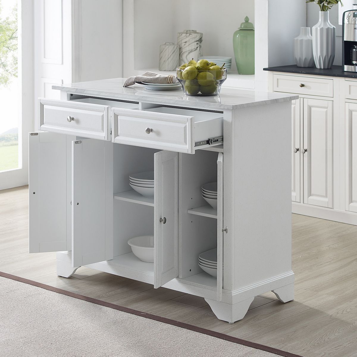 Open white kitchen island cart showing shelves and drawers