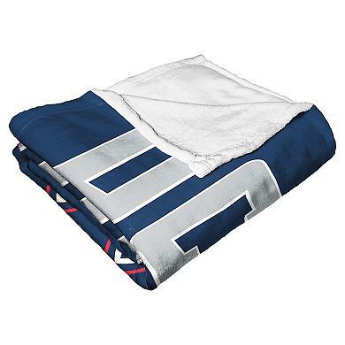 The Northwest UConn Huskies Alumni Silk-Touch Throw Blanket