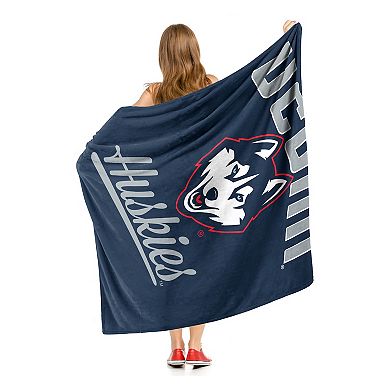 The Northwest UConn Huskies Alumni Silk-Touch Throw Blanket