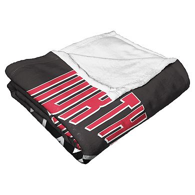 The Northwest Northern Illinois Huskies Alumni Silk-Touch Throw Blanket