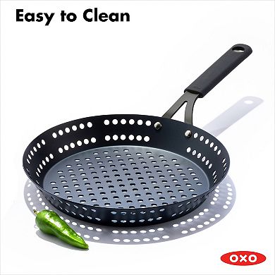 OXO Obsidian Pre-Seasoned Carbon Steel 12-in. Frypan with Holes for Grilling with Removable Silicone Handle Holder