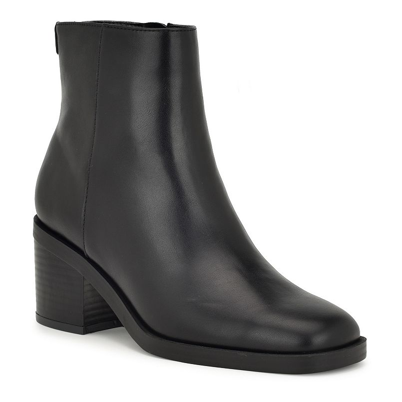 A black ankle boot with a block heel