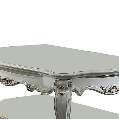 Traditional Style Wooden Coffee Table with Polyresin Carvings and Bottom Shelf, White