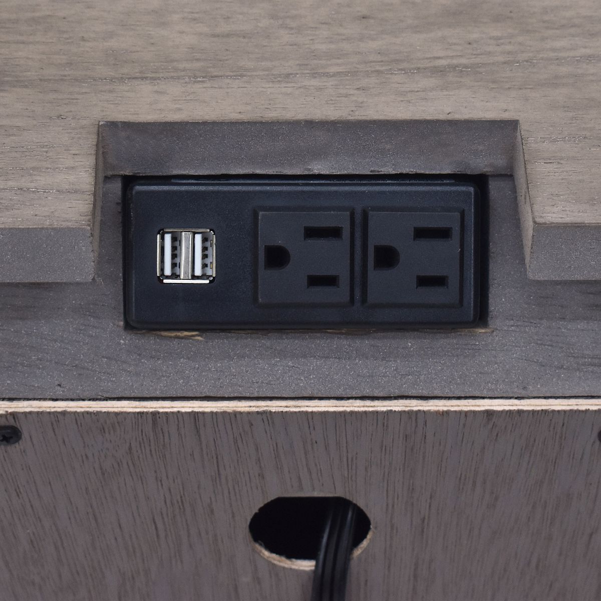 Charging station outlet module on the nightstand drawer face