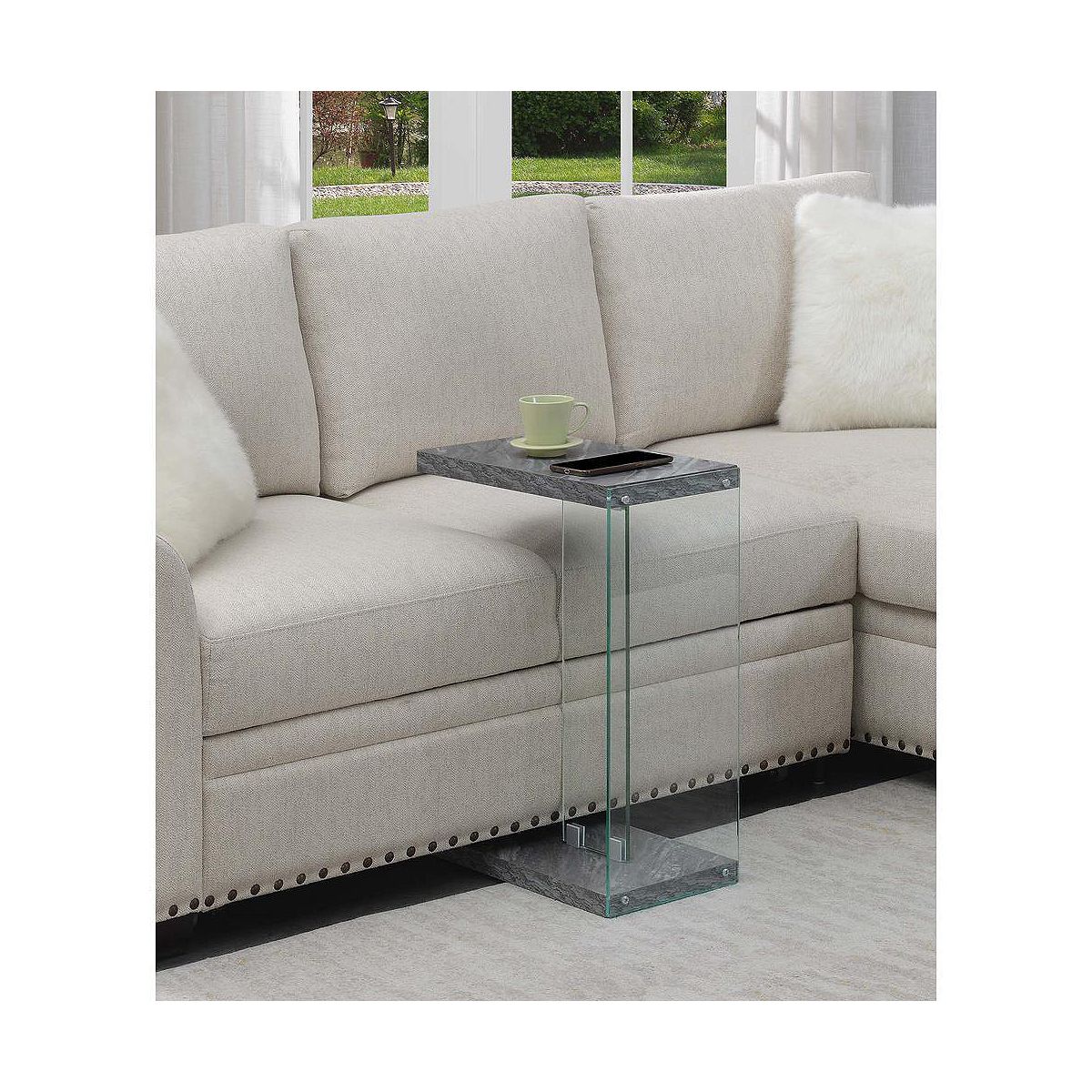 SoHo C end table with clear glass frame and dark wood/gray shelves beside sofa
