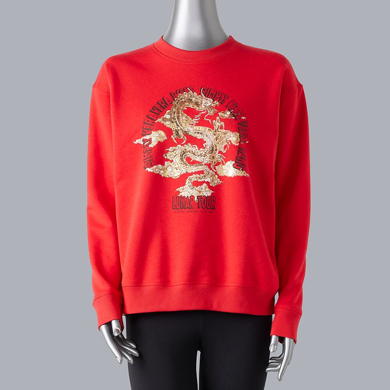 woman wearing red sweater year of the dragon sweatshirt from vera wang