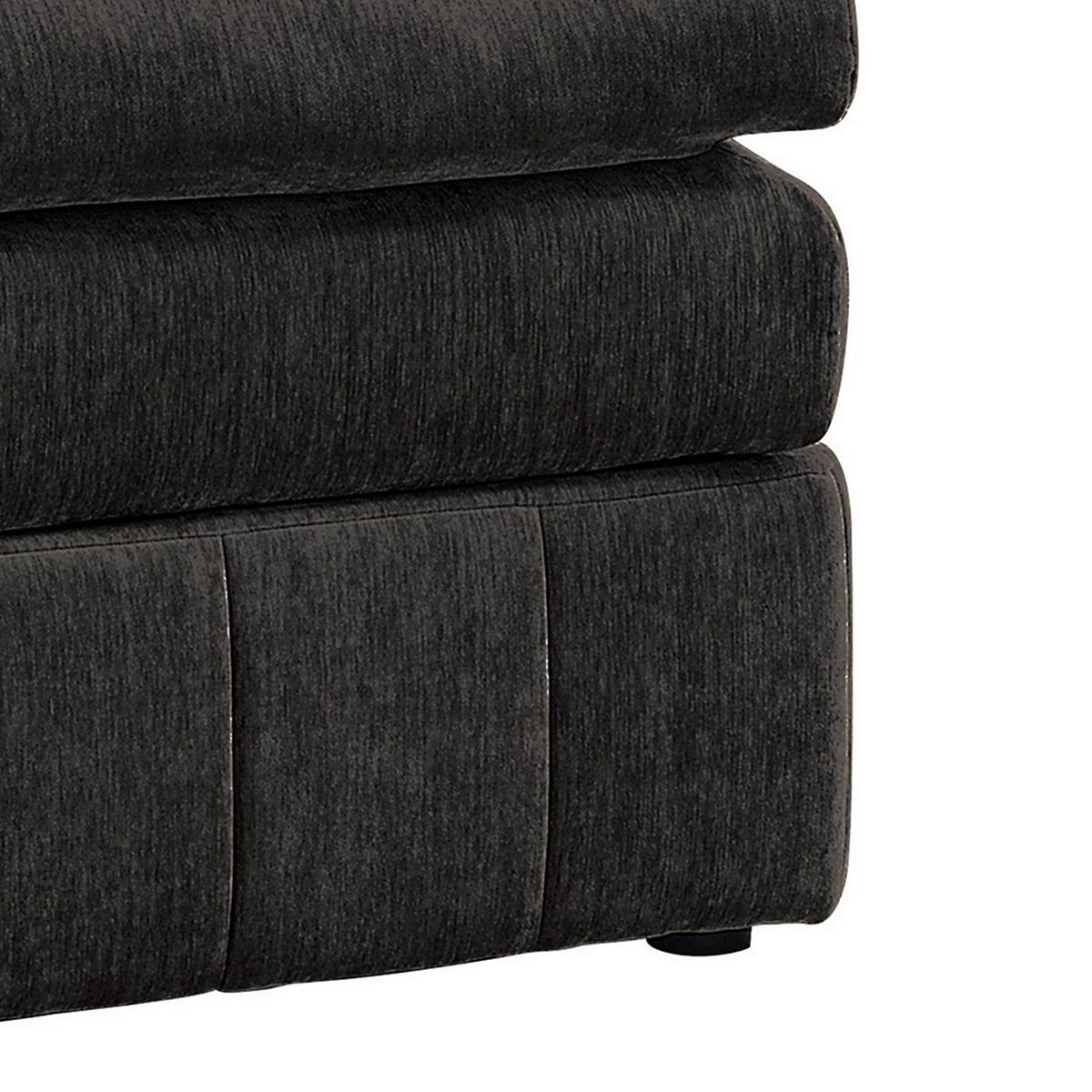 Side corner close-up of dark gray Luna modular ottoman with segmented base panels.