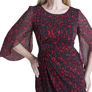Enjoy an elegant look with this women's Connected apparel cape A-line dress.