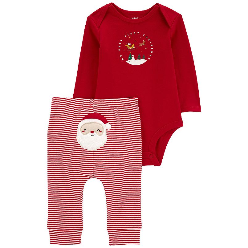 A red baby bodysuit with a circle graphic and red and white pants with Santa on them