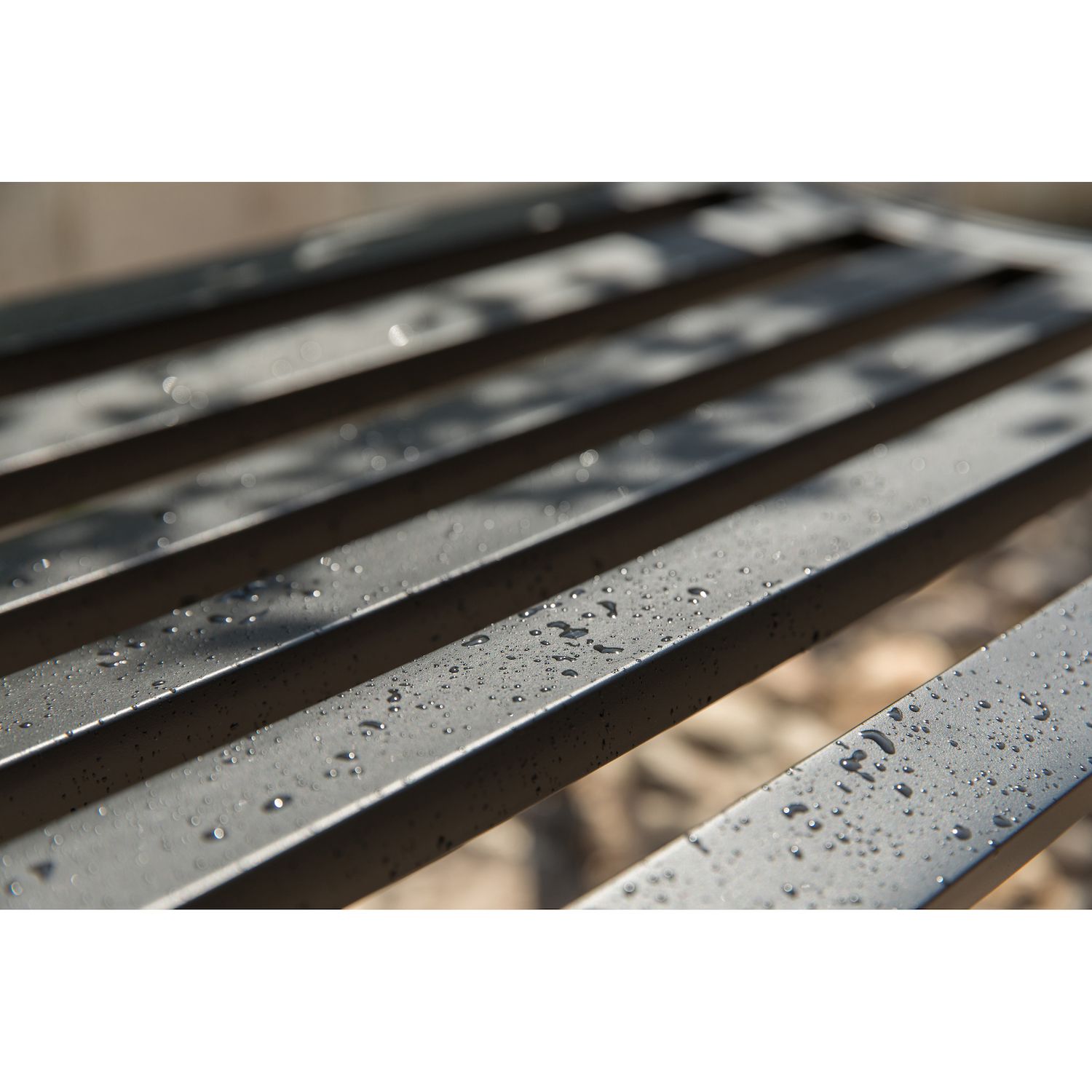 Close-up of the metal slats with water droplets