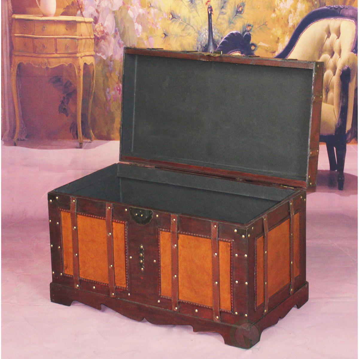 Open large antique style steamer trunk with dark interior liner