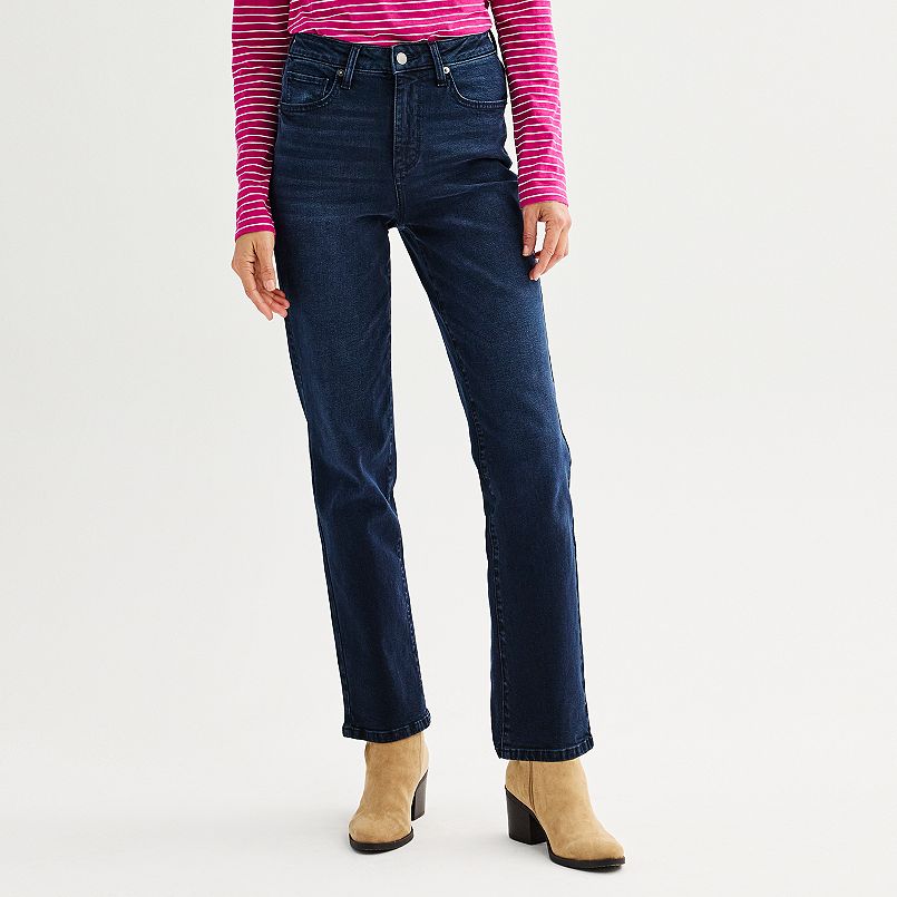 A woman wearing dark blue jeans