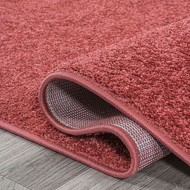 Haze Solid Low Pile Area Rug Red