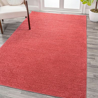 Haze Solid Low Pile Area Rug Red