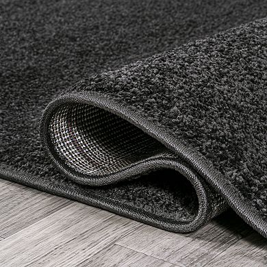 Haze Solid Low Pile Area Rug Black