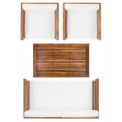 Top-down view of wooden slatted coffee table and white cushions in seating arrangement