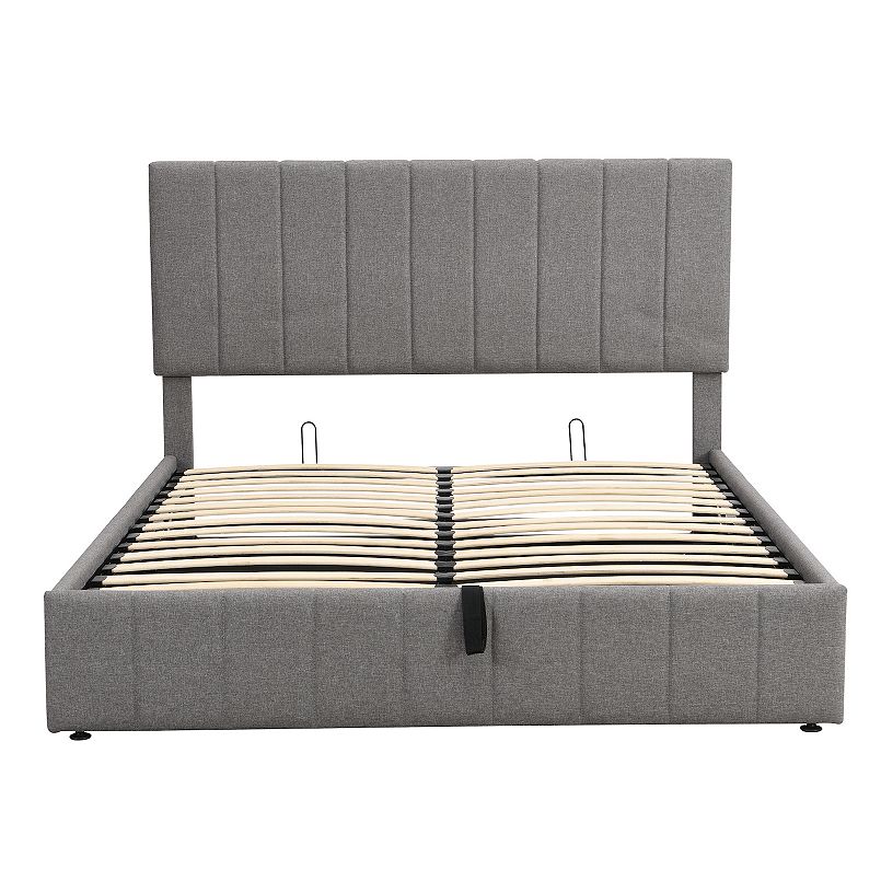 Upholstered platform bed frame with hydraulic storage in gray fabric, headboard visible