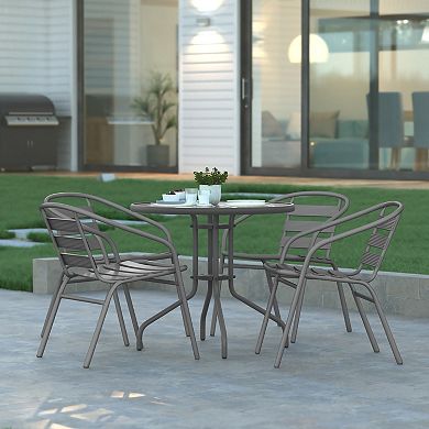 Emma And Oliver Rhea 31.5'' Round Glass Top Metal Table With 4 Aluminum Slat Stack Chairs