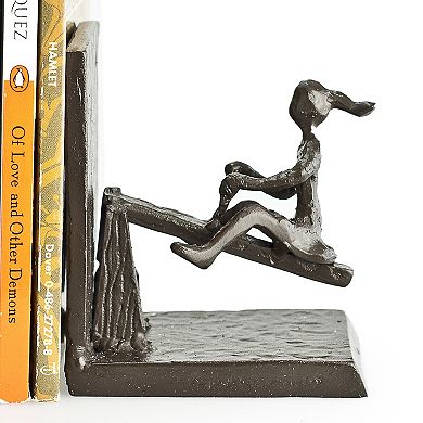 Children Playing On A See-saw Metal Bookend Set