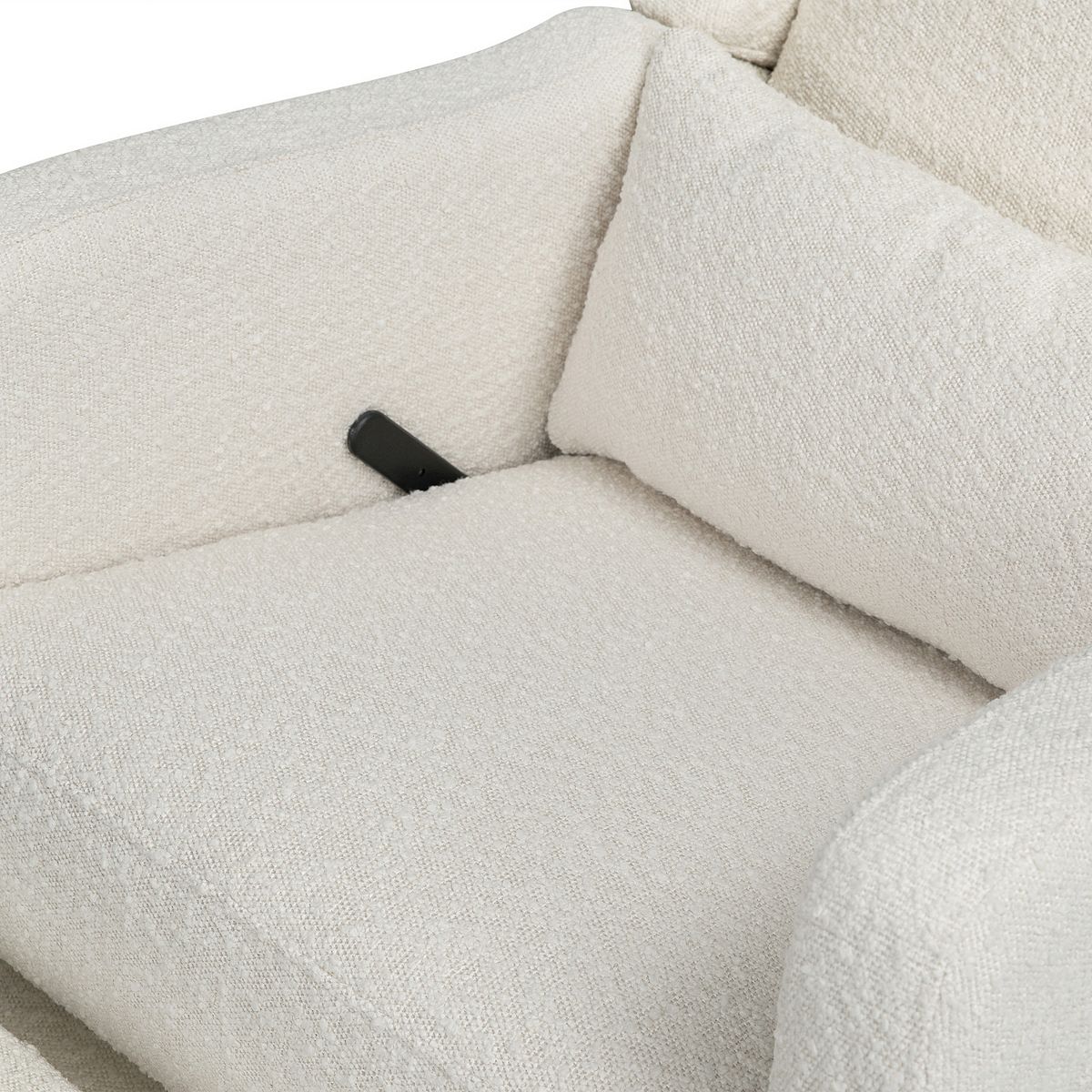 Close-up of cream recliner glider seat and arm cushion