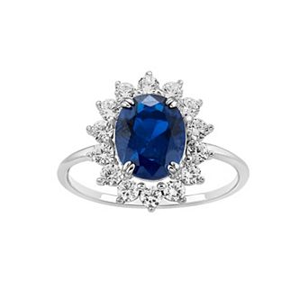PRIMROSE Sterling Silver Simulated Sapphire Oval Center Stone With Cubic Zirconia Flower Polished Band Ring