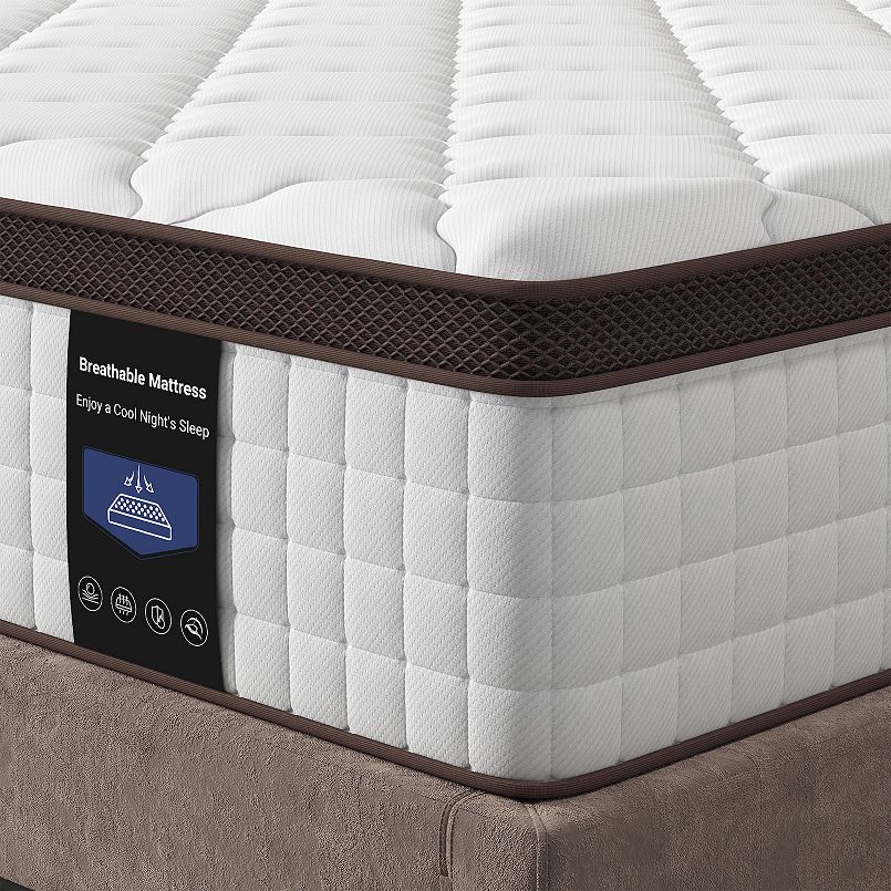 Close-up of mattress corner showing quilted white fabric with brown border