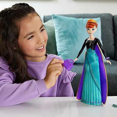 Disney's Frozen Spin & Reveal Anna Fashion Doll & Accessories with 11 Surprises from Mattel