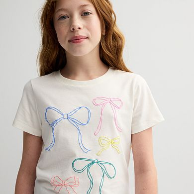 Girls 6-20 SO® Short Sleeve Graphic Baby Tee in Regular & Plus