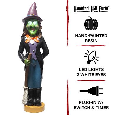 Haunted Hill 4-Ft. Scary Witch Holding a Broom Prelit LED Resin, Indoor or Covered Outdoor Halloween Decoration, Plug-In