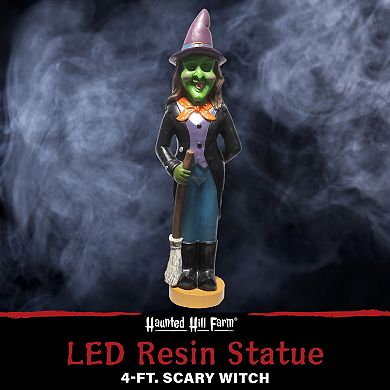 Haunted Hill 4-Ft. Scary Witch Holding a Broom Prelit LED Resin, Indoor or Covered Outdoor Halloween Decoration, Plug-In