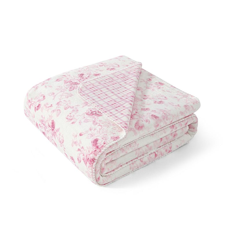 A pink and white floral blanket
