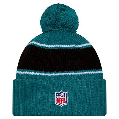 Youth New Era Teal Jacksonville Jaguars 2024/25 Sideline Cuffed Knit Hat with Pom