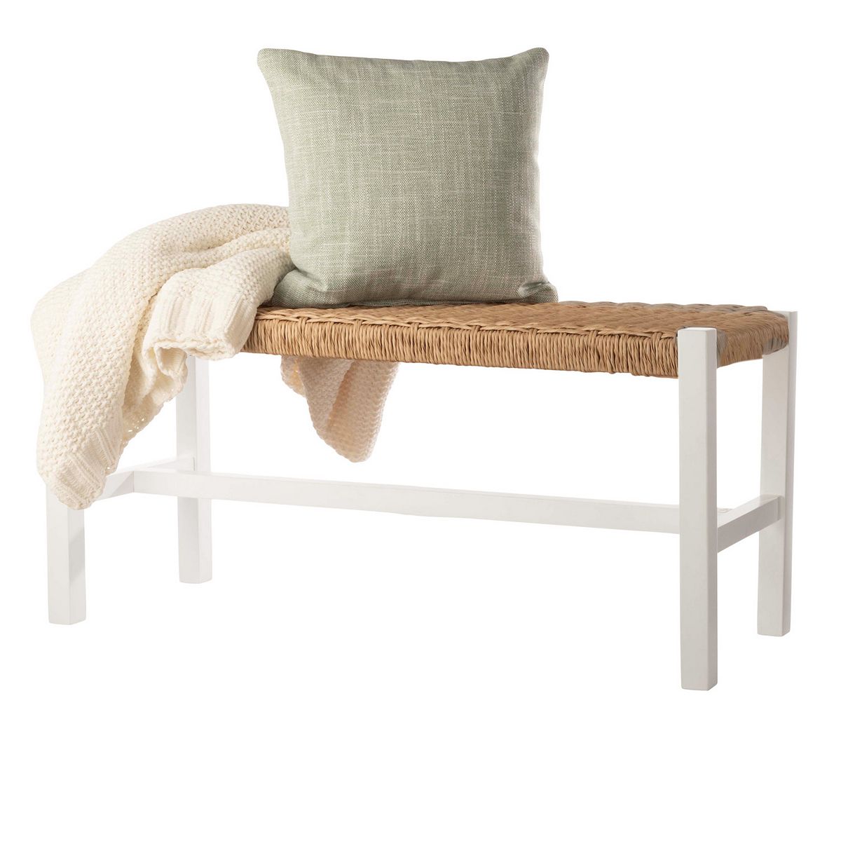 Entryway bench with woven rattan seat and white frame styled with cushion and throw