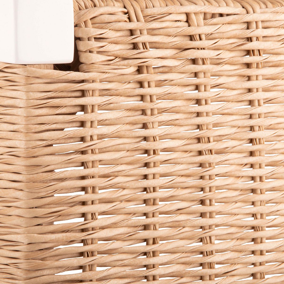 Close-up of woven rattan seat texture on entryway bench