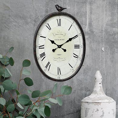 Storied Home Antique Bronze Finish Metal Oval Wall Clock with Bird