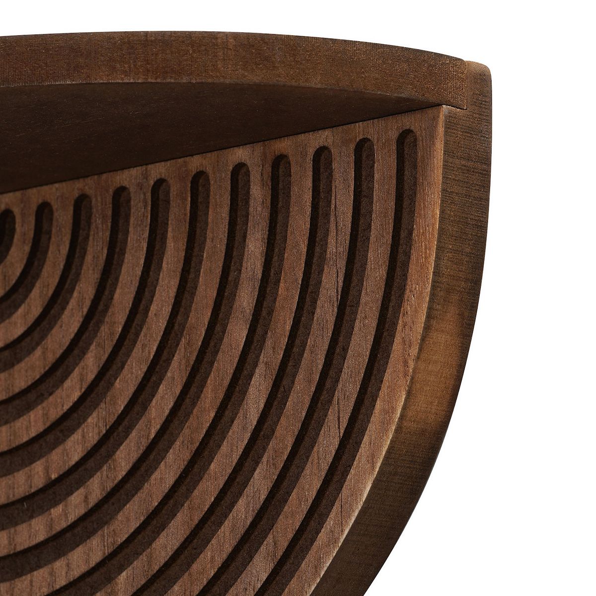 Close-up of concentric arc groove pattern on half-circle shelf