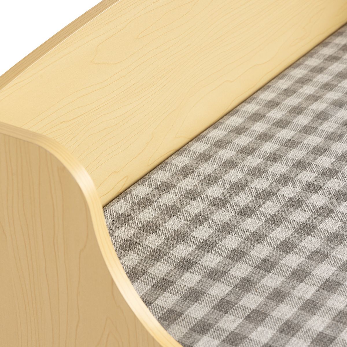 Curved front edge and gray plaid cushion on Humble Crew bench