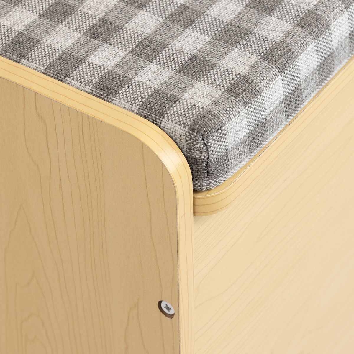 Side corner and upholstered edge on Humble Crew toy storage bench