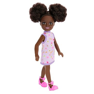 Barbie Chelsea Doll, Small Doll Wearing Removable Purple Floral Dress with Space Buns & Brown Eyes by Mattel