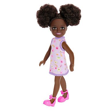 Barbie Chelsea Doll, Small Doll Wearing Removable Purple Floral Dress with Space Buns & Brown Eyes by Mattel