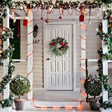 Regal Holiday Glam 24" Christmas Wreath, Prelit with Frosty Branches, Snowy Pinecones and Red Bows