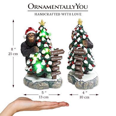 Whimsical Bigfoot Behind Christmas Tree Figurine, 7.5" Funny Holiday Yeti LED Statue, He Sees You