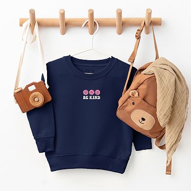 The Juniper Shop Embroidered Be Kind Turning Smiles Toddler Sweatshirt