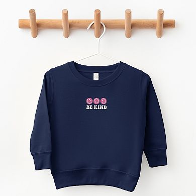 The Juniper Shop Embroidered Be Kind Turning Smiles Toddler Sweatshirt