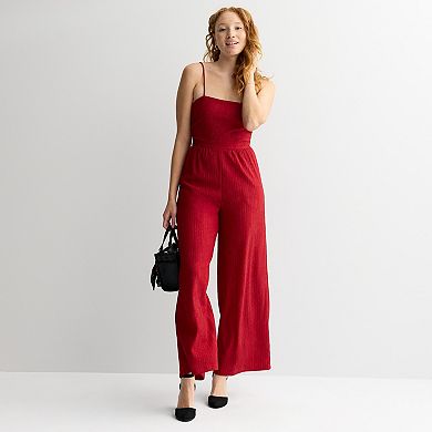 Juniors' Live To Be Spoiled Glitter Jumpsuit