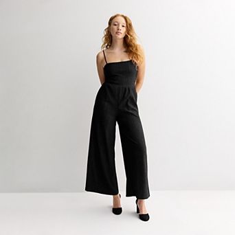 Juniors' Live To Be Spoiled Glitter Jumpsuit