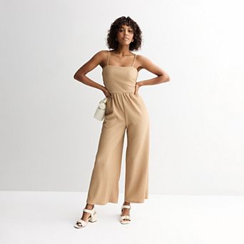 Juniors' Live To Be Spoiled Glitter Jumpsuit