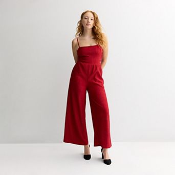 Juniors' Live To Be Spoiled Glitter Jumpsuit