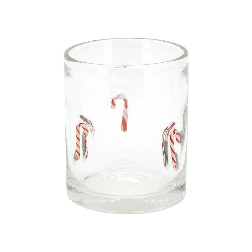 Clear glass tumbler decorated with red-and-white candy cane swirls